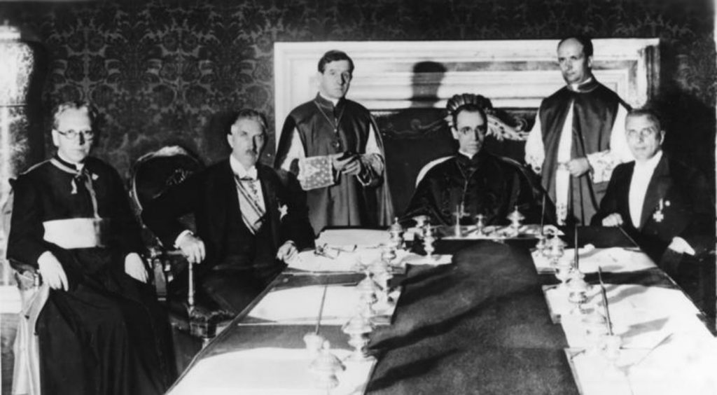 : German Vice-Chancellor Franz von Papen with German prelate Ludwig Kaas, Secretary of Extraordinary Ecclesiastical Affairs Giuseppe Pizzardo, Cardinal Secretary of State Eugenio Pacelli, Alfredo Ottaviani, and member of Reichsministerium des Inneren [Home Office] Rudolf Buttmann on the day that the signing of the Reichskonkordat occurred.