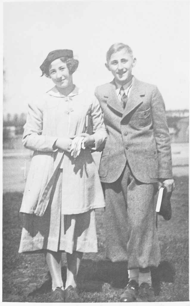 Gad Beck stands with his twin sister Miriam, smiling, on the day of his Bar Mitzvah.