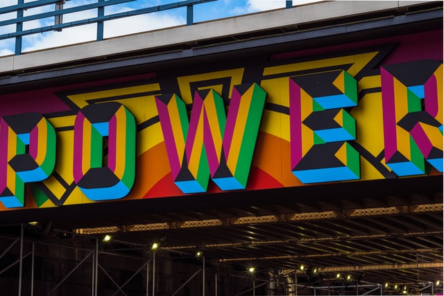 large sign with the word “power” in many colours