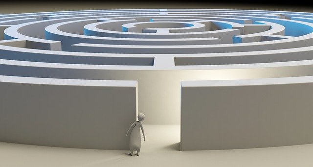 Graphic of a maze with a person looking in the entrance