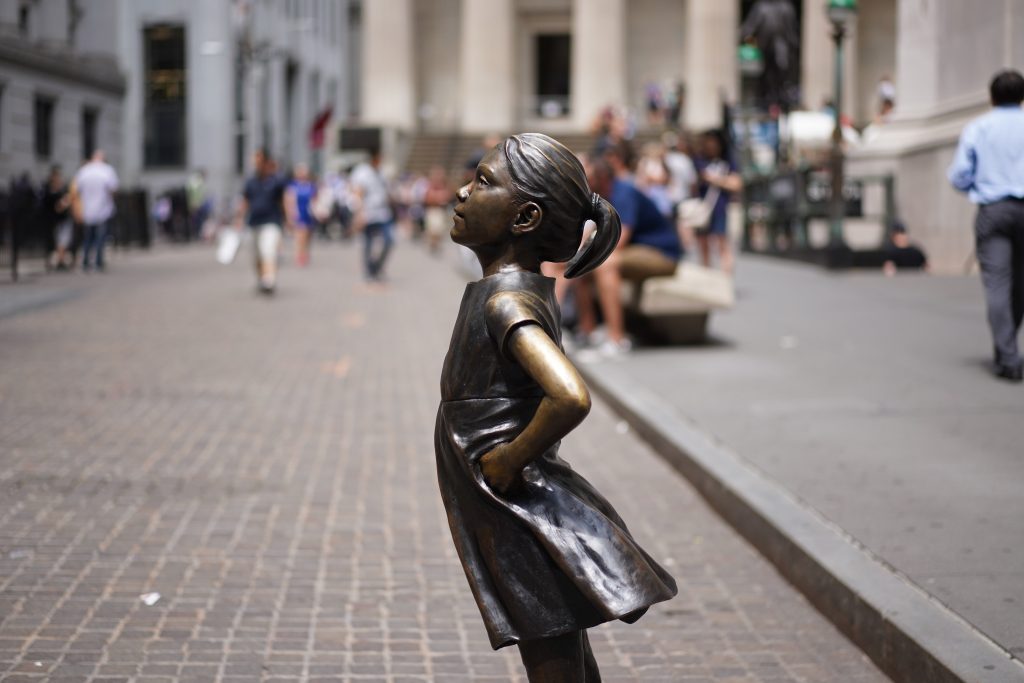 statue of girl standing proudly