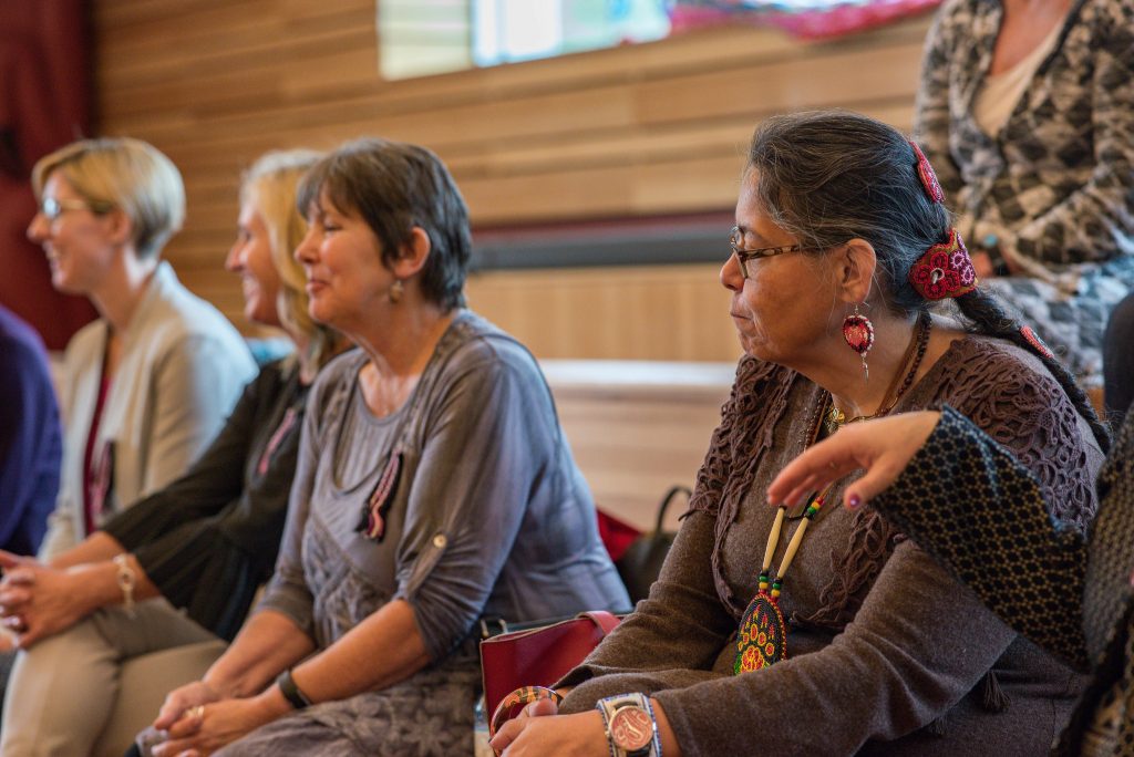 People seated participating in the Metis Nation \-BC join project announcement