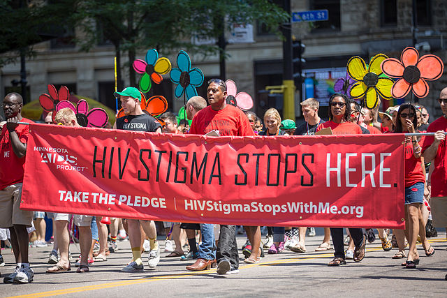 people marching in the streets at Minnesota AIDS Project at the Twin Cities Pride Parade