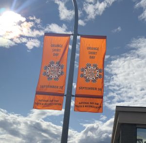 two street light banners for the inaugural Orange Shirt Day, September 30, 2021.