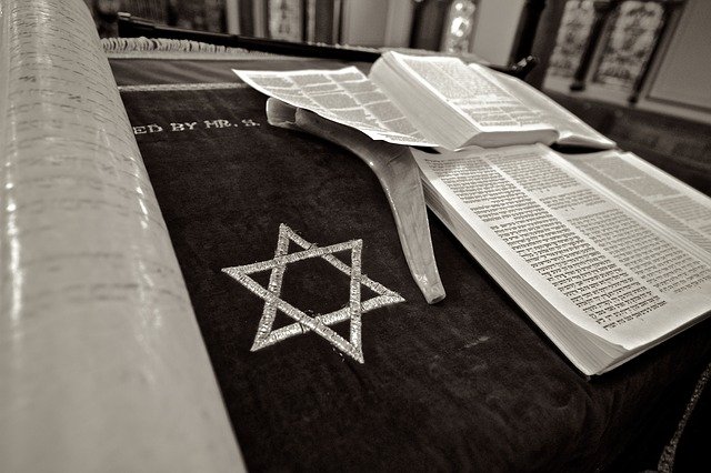 Star of David Symbol on cloth with Old Testament in Hebrew