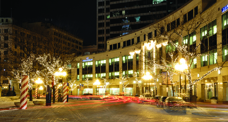 This image shows the Anthem Inc. building lit up at night.