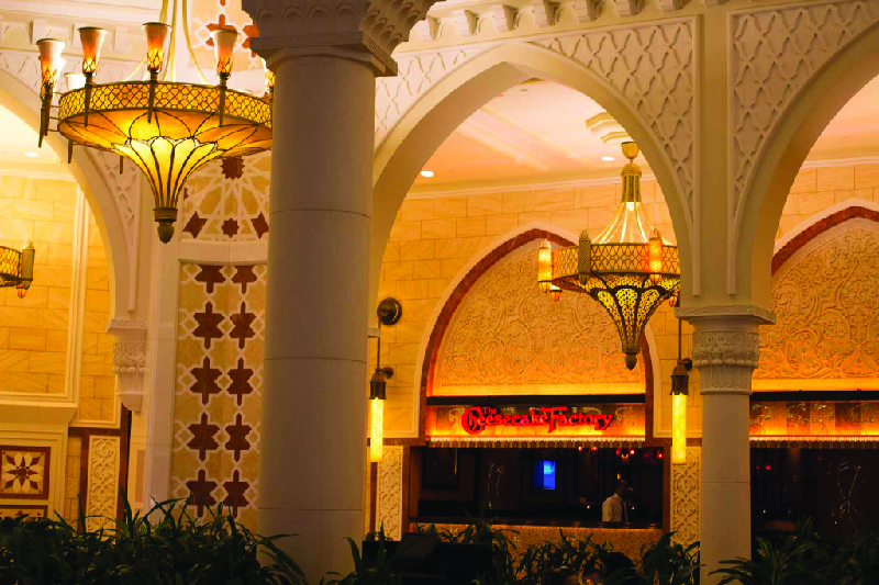 This image shows a Cheesecake Factory restaurant located in a mall in Dubai.