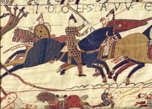 A tapestry of soldiers fighting on horseback.