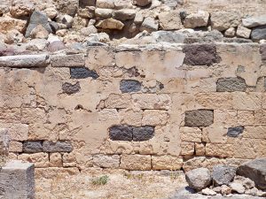 Image of brick wall with remnants of plaster coating in Aegina