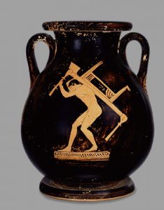 In the Greek household, enslaved men carried out labour-intensive jobs. This man in the image is moving heavy furniture (maybe a wooden reclining seat) about the house.