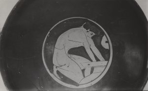 Kylix with depiction of a man reaching into a half buried pithos.
