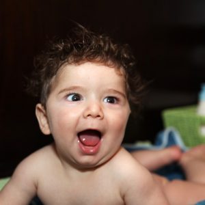 Infant child smiling after a bath