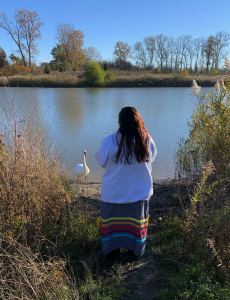 Jaimie at shore with swan