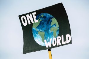 sign that reads One World