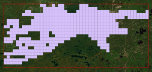 A satellite image of the Lake Nipissing area with a hollow red rectangle drawn over top of it. Some areas of the rectangle are filled by a grid of purple squares.