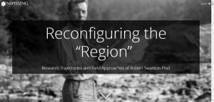 Screenshot of a splash page for an online storymapping project called 'Reconfiguring the 'Region': Research Trajectories and Field Approaches of Robert Swanton Platt.' A transparent text box with title appears over a black-and-white photograph of Platt, a white man with brown hair and glasses. Platt looks into the camera while holding a field notebook outdoors.