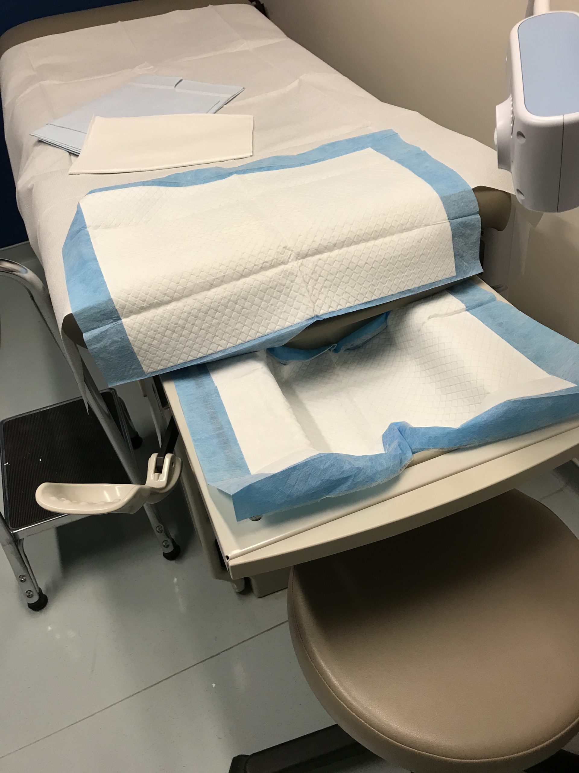 Fully prepared examination bed with stirrups