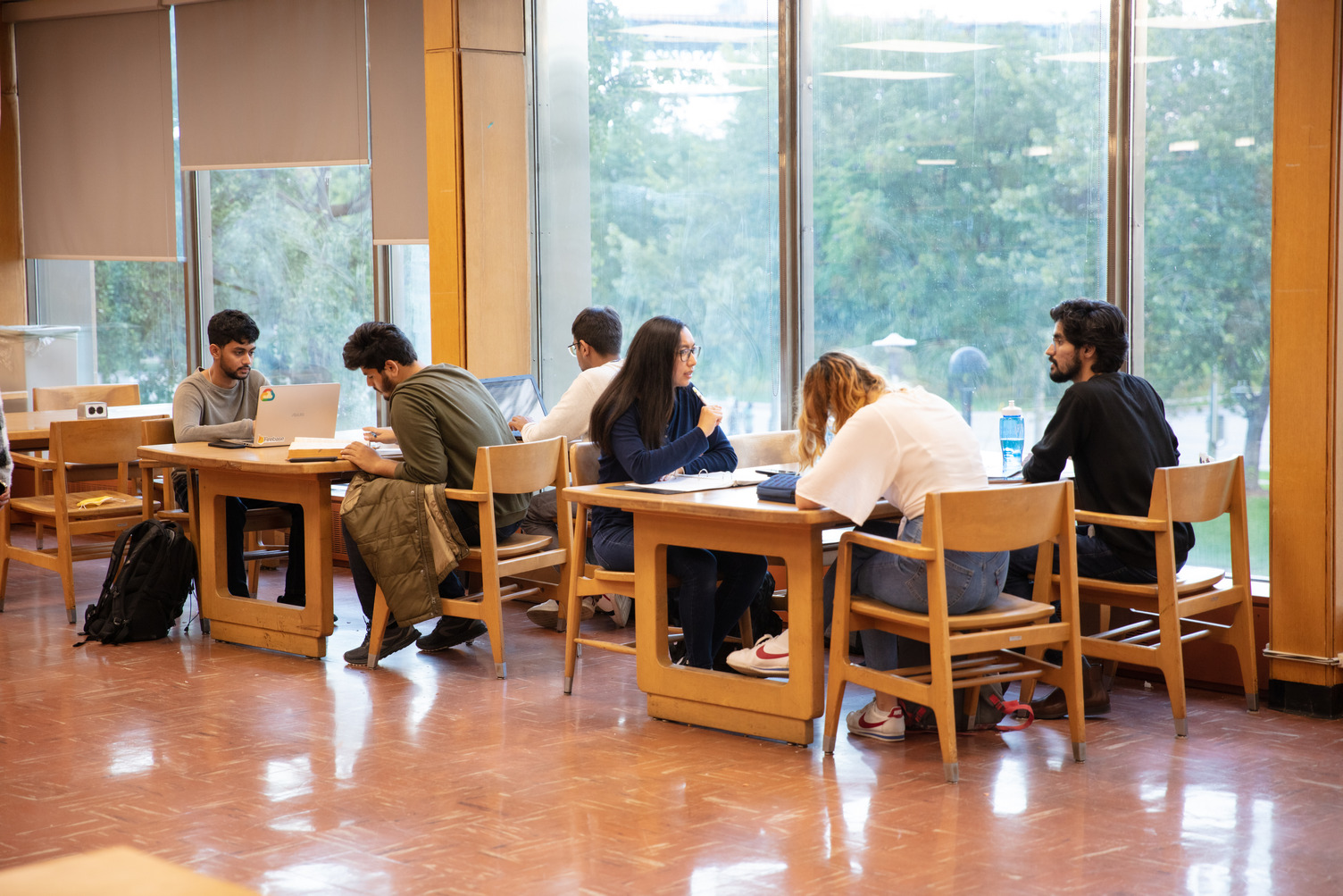 A group of students sitting at a shared table
