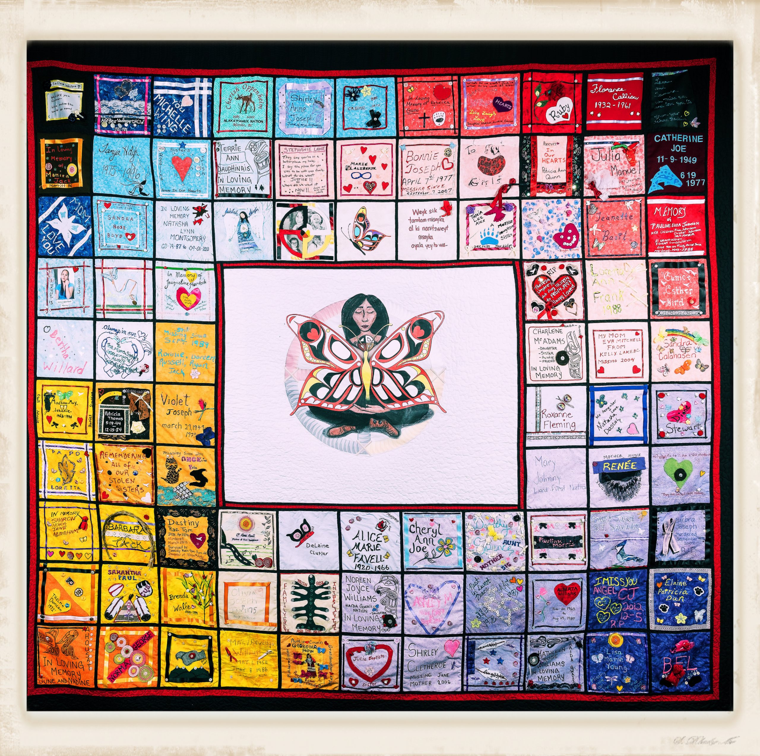 quilt with images expressing love for, messages to, and names of murdered and missing Indigenous women and girls