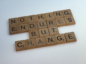 Scrabble tiles that spell out the statement, "Nothing endures but change."