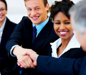 Two business people shaking hands at meeting