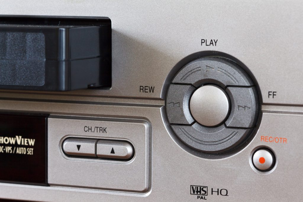 close up photo of controls for a video cassette player