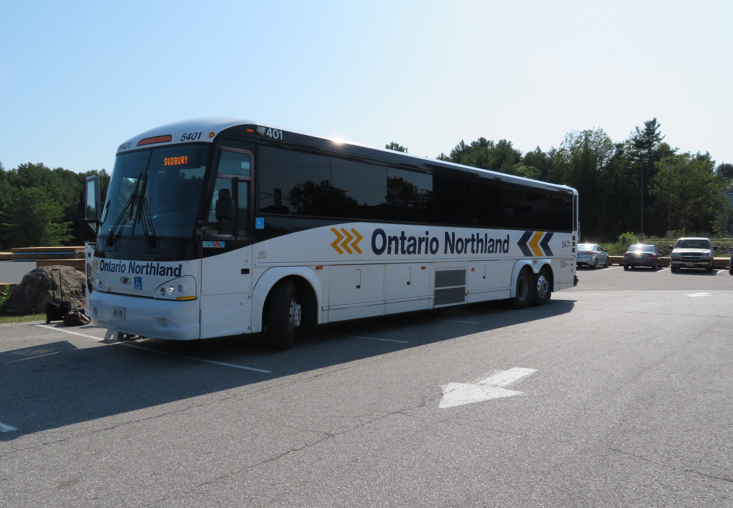Photo of a white bus with white and yellow accents labelled "Ontario Northland"