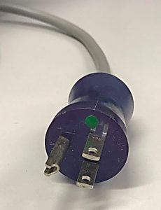 Example of power cords used by biomedical equipment. Hospital grade power cord with green dot and U-shaped prong attached to ground wire.