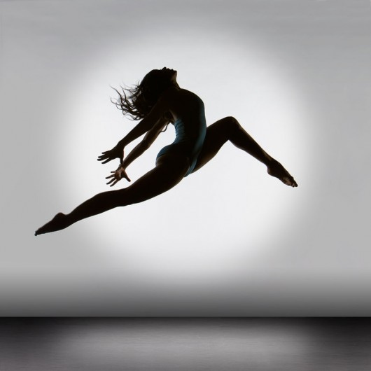 A dancer leaps into the air