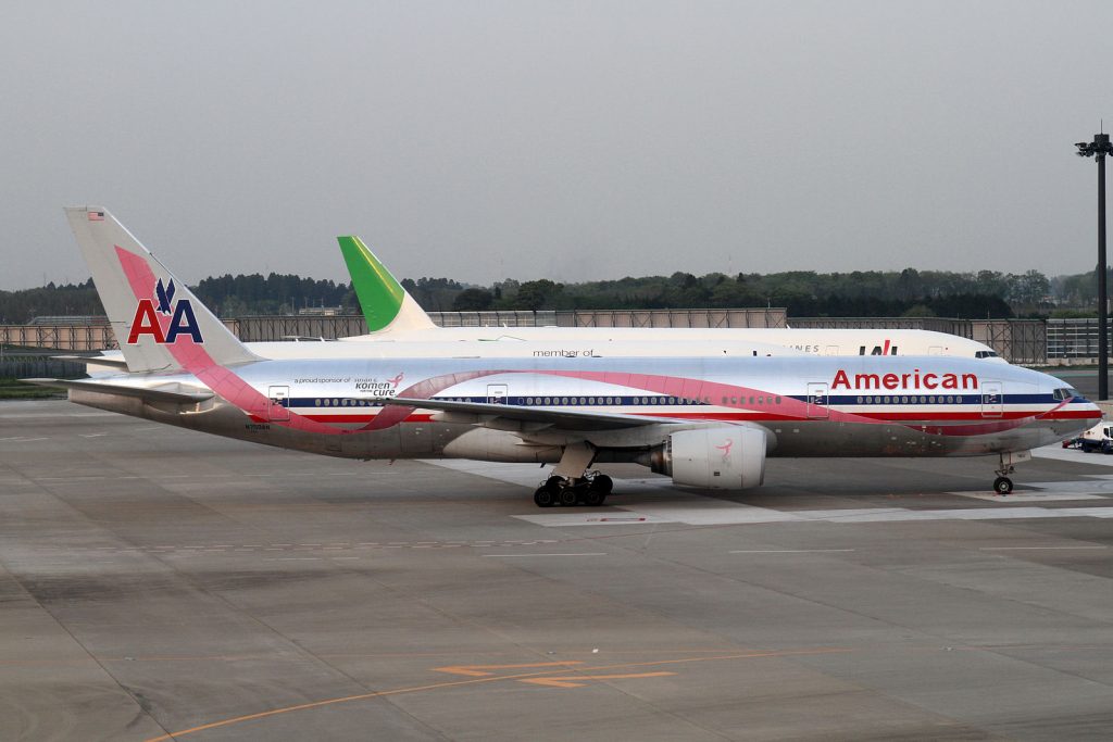 An American Airlines Boeing 747 with a pink ribbon painted on it