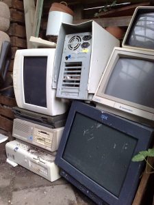 A pile of old monitors and computer central units