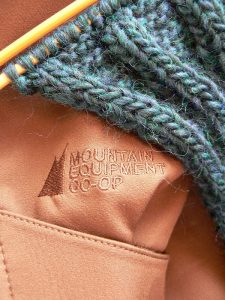 MEC bag with knitting on top