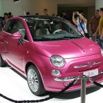 A pink two doored car