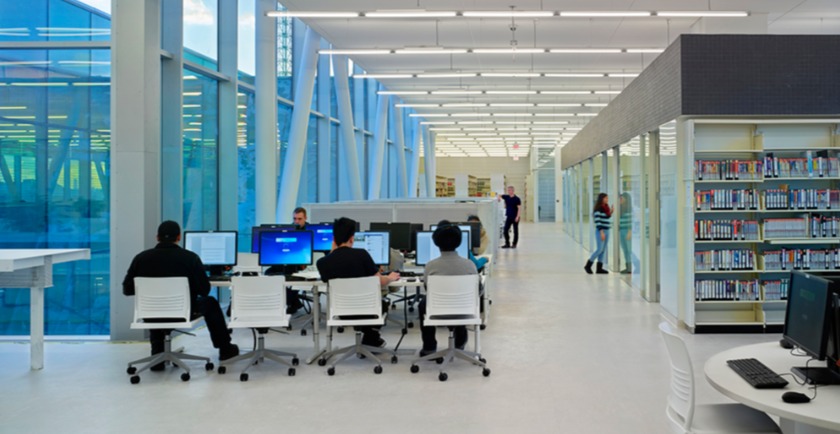 Ashtonbee campus library, students sitting at computer stations