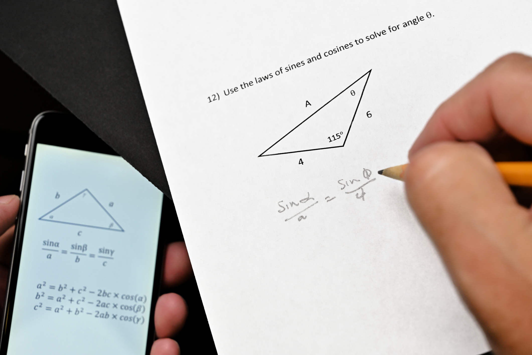 Student using a smart phone to cheat on a trigonometry test