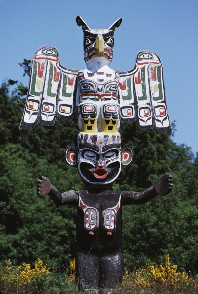 Memorial totem pole by master carver Hilamas (Willie Seaweed) portraying Thunderbird and Wild Woman of the Woods