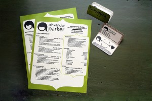 A stylized set of resumes and business cards with a green border.