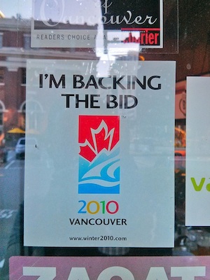 A sign posted on a pub's window reads, "I'm backing the bid. 2010 Vancouver."