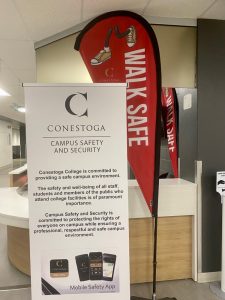 Walksafe sign and Conestoga Campus Safety and Security sign
