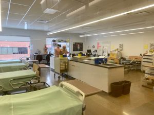 Lab classroom with beds, mannequines, and teaching aids