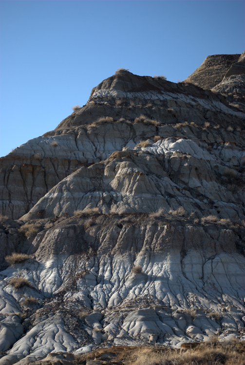 A rock formation showing various layers is shown.