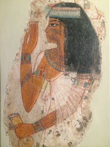 An Egyptian woman in a tomb painting showing upper class dress