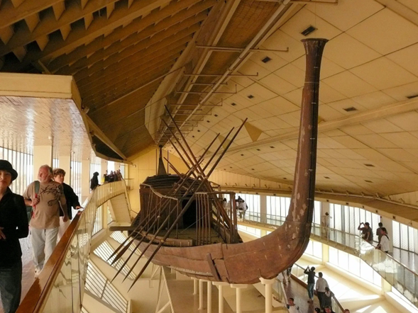 The boat is intact, wooden and we can see the elegant design and size relative to the people in the museum