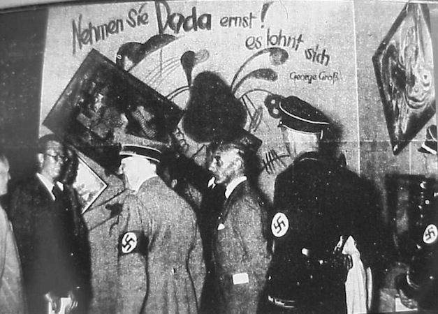 Adolf Hitler and Adolf Ziegler inspect the installation by Willrich and Hansen of the Degenerate Art Exhibition in Munich, 1937