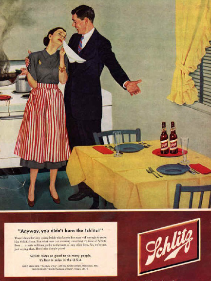 In a kitchen, a man consoles a tearful woman saying "Anyway, you didn't burn the Schlitz"