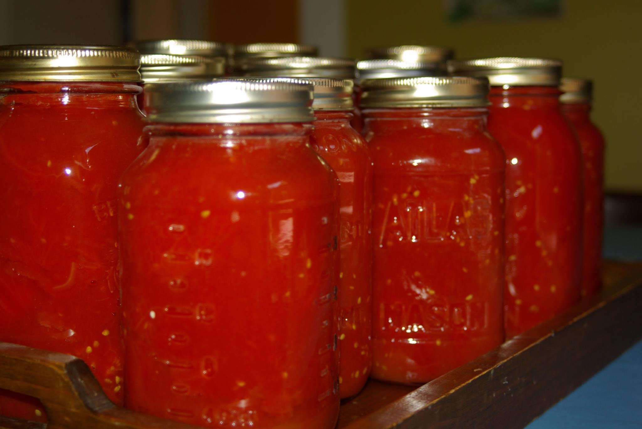 Several jars of home canned tomatoes.