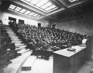 black and white photo of students in a lecture hall
