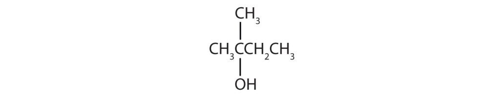 From left to right, there are four carbons on the alkane straight chain with a methyl and hydroxyl group on carbon 2.