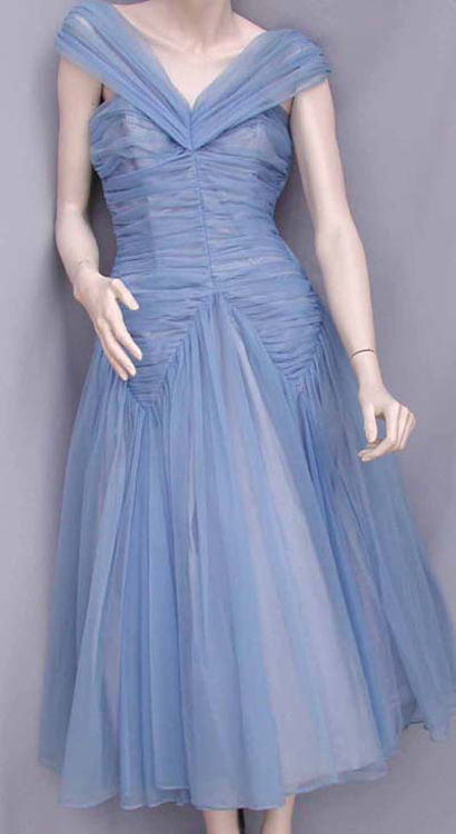 An image showing a blue nylon fabric ballgown worn on a mannequin.