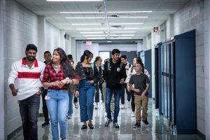 Students walking down a hallway.